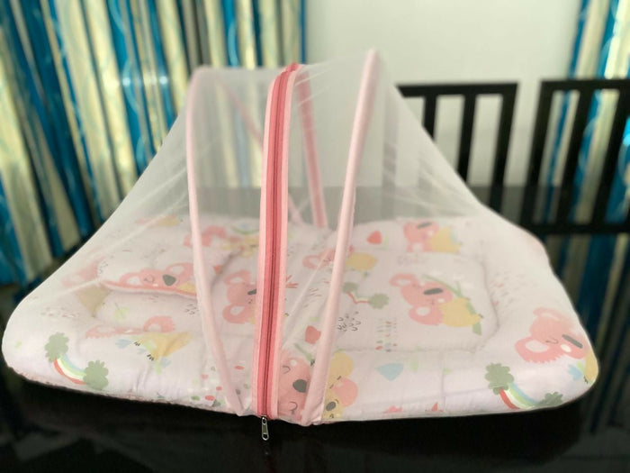 Baby crib with pink and white canopy on a black surface