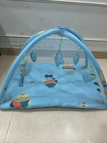 Baby bed with hanging toys featuring a soft cushioned sleeping area, protective sides, and colorful hanging toys to keep babies comfortable, engaged, and entertained.