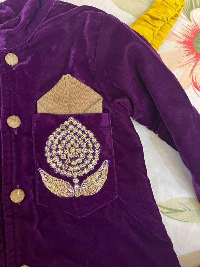 Elegant purple baby sherwani with intricate detailing, soft fabric, and comfortable fit, perfect for festive occasions and celebrations.
