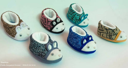 Set of colorful baby shoes with animal designs