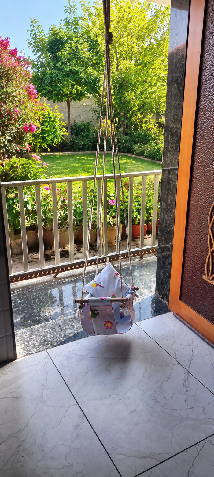 Baby Swing with gentle rocking motion, comfortable padded seat, safety harness, sturdy frame, and soothing design to help keep babies relaxed, entertained, and comfortable during supervised rest.