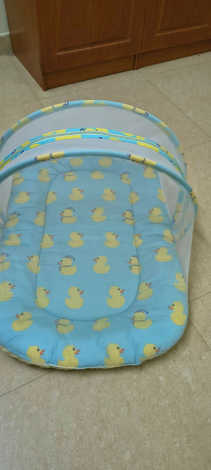 BABYHUG cotton bedding set with mosquito net featuring a soft mattress, pillow, breathable cotton fabric, and protective mosquito net for a comfortable and secure sleeping environment for babies.