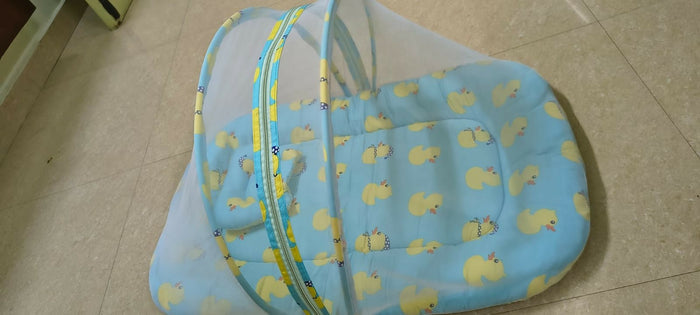 BABYHUG cotton bedding set with mosquito net featuring a soft mattress, pillow, breathable cotton fabric, and protective mosquito net for a comfortable and secure sleeping environment for babies.
