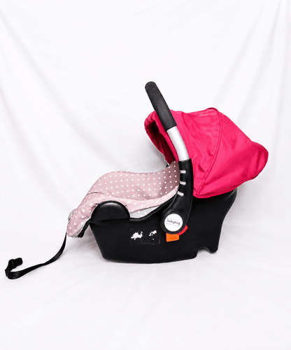 BABYHUG infant car seat carry cot with baby carrier function, rear-facing design, cushioned seat, secure safety harness, and carry handle for newborns and infants up to 13 kg.
