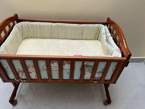 BABYHUG cradle with BABYHUG mattress and bumpers featuring cozy sleeping space, cushioned mattress, protective side bumpers, sturdy frame, and comfortable support for baby sleep.