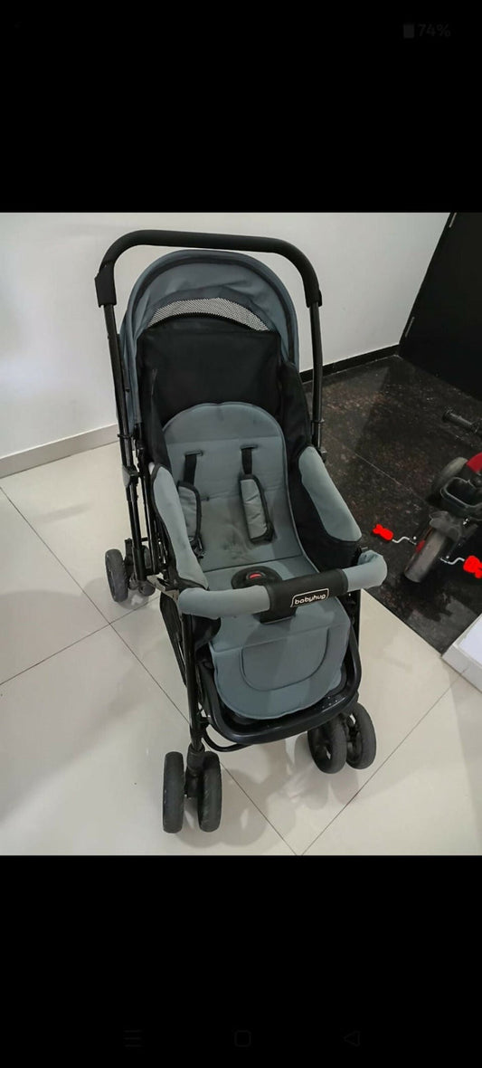 Babyhug Symphony stroller with reclining seat, smooth wheels, safety harness, adjustable canopy, and comfortable travel design for babies and toddlers.