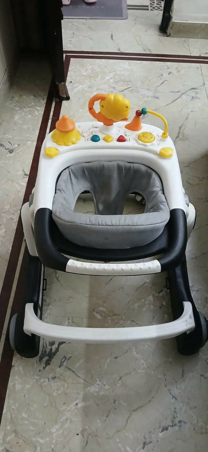BAYBEE Astro 2-in-1 baby walker – convertible seated & push walker with music, height adjustment & safety features.
