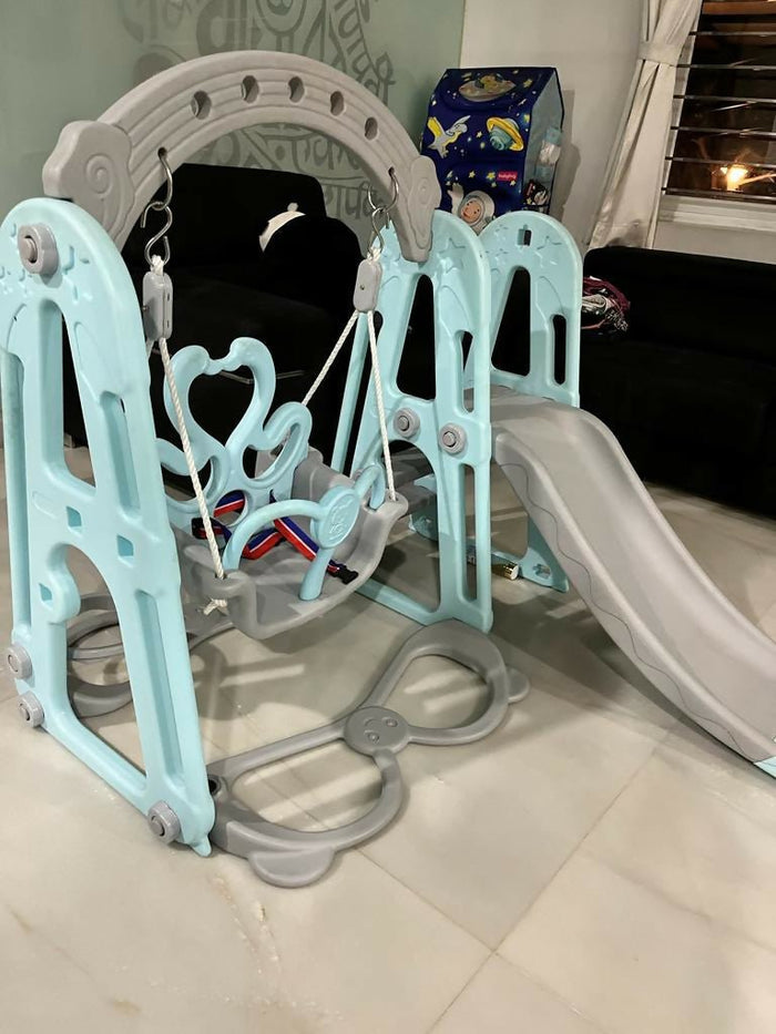 BAYBEE Twinkle 4-in-1 Swing & Slider Foldable Baby Garden Slide with swing, slide, basketball hoop, foldable design, sturdy construction, and smooth edges for safe indoor and outdoor play.