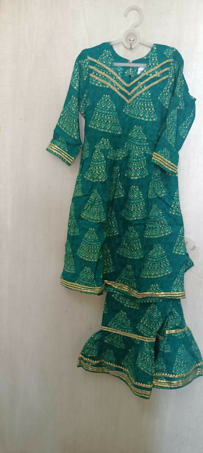 Make a style statement with our Beautiful Green Color Peplum Top and Garara Set, offering elegance and sophistication for festive occasions and parties.