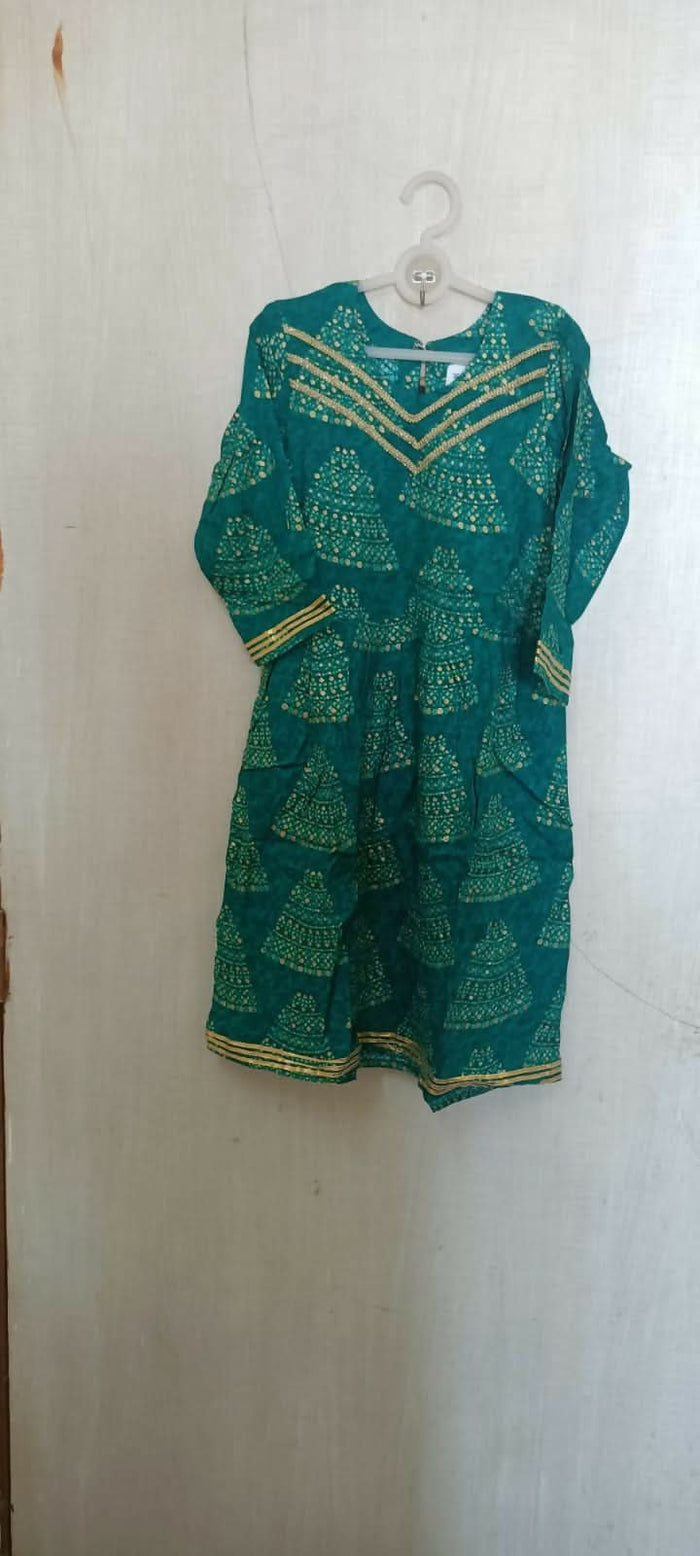 Make a style statement with our Beautiful Green Color Peplum Top and Garara Set, offering elegance and sophistication for festive occasions and parties.