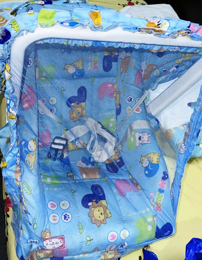 Children's playpen with cartoon animal patterns on a blue background