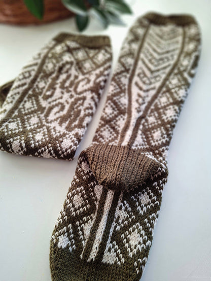 Pair of brown and white patterned socks on a light background