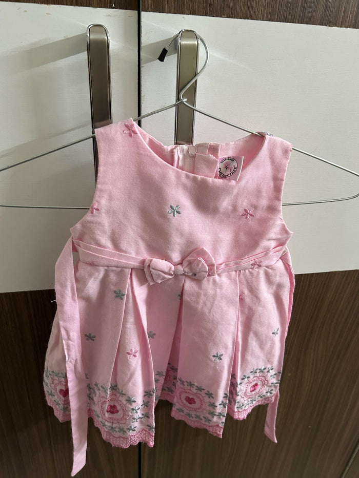 Pink children's dress with floral embroidery