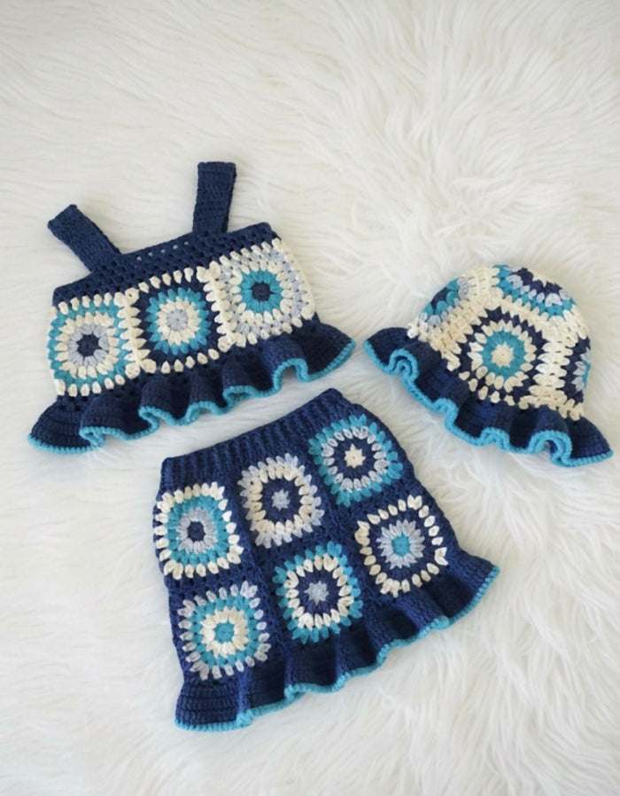 Crocheted baby outfit with dress and hat