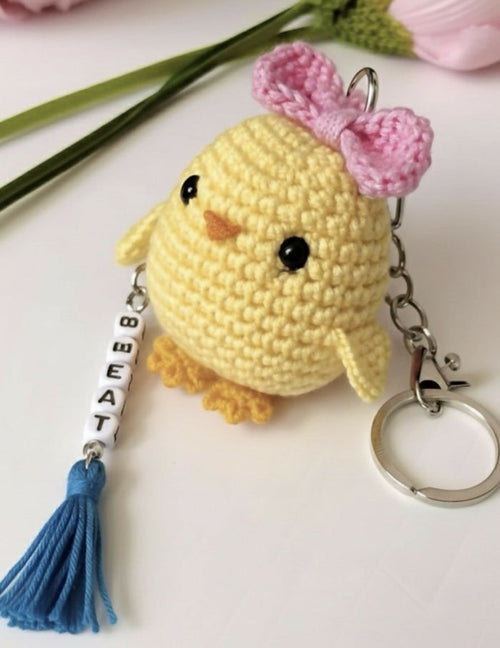 Yellow chick keychain with pink flower and tassel