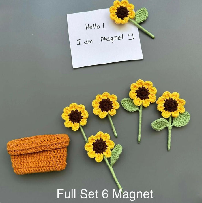Set of sunflower-shaped magnets with a small orange basket