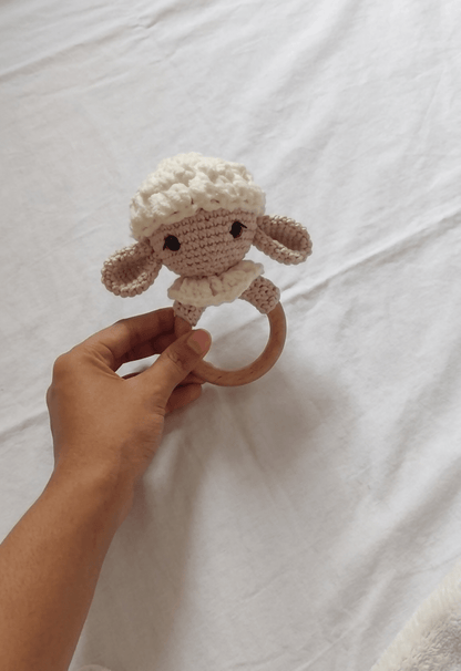 Handmade crochet rattle for babies with soft yarn construction, easy-to-hold design, gentle rattling sound, and baby-friendly craftsmanship for sensory play and development.
