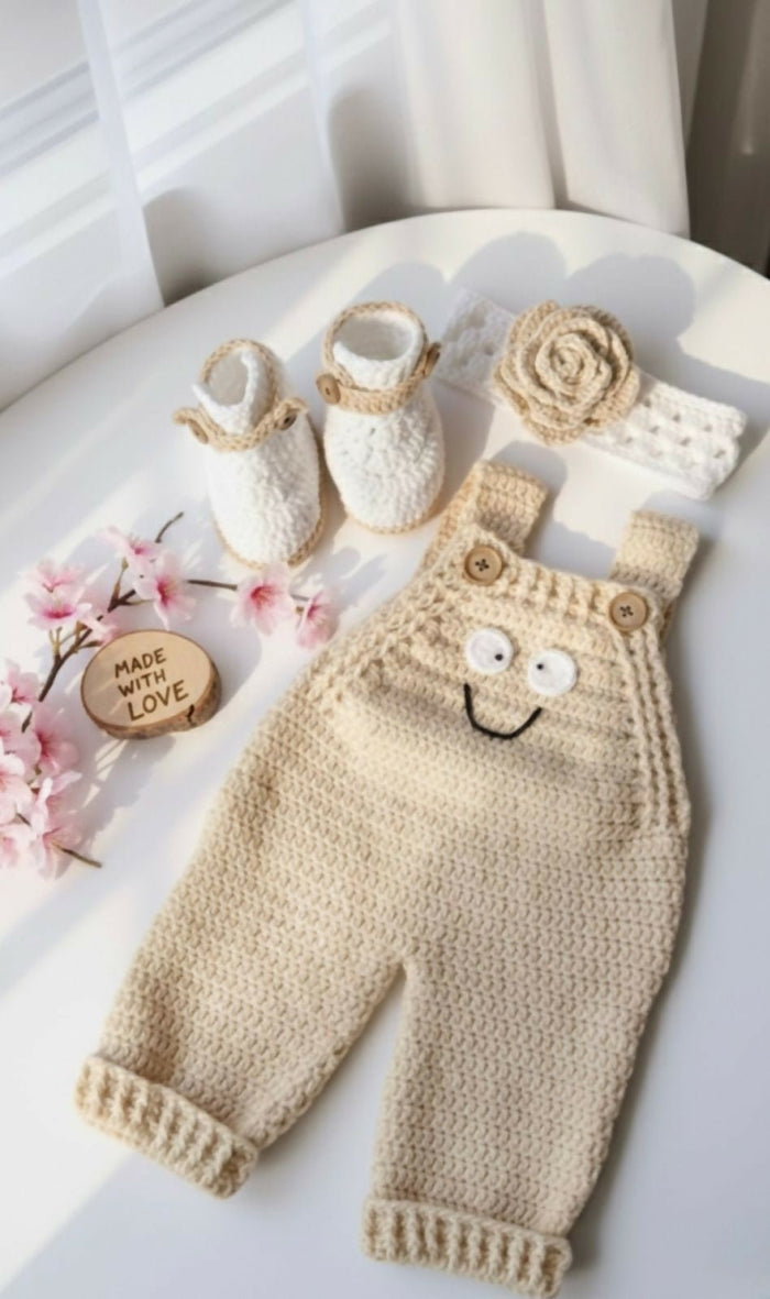 Knitted baby overalls with matching booties and headband