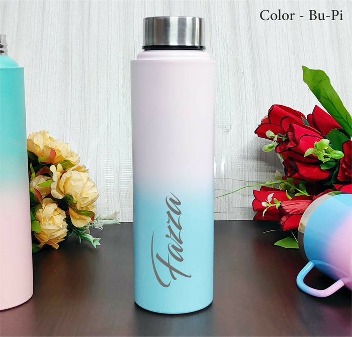 Gradient water bottle with 'Faizza' branding on a wooden surface with flowers.