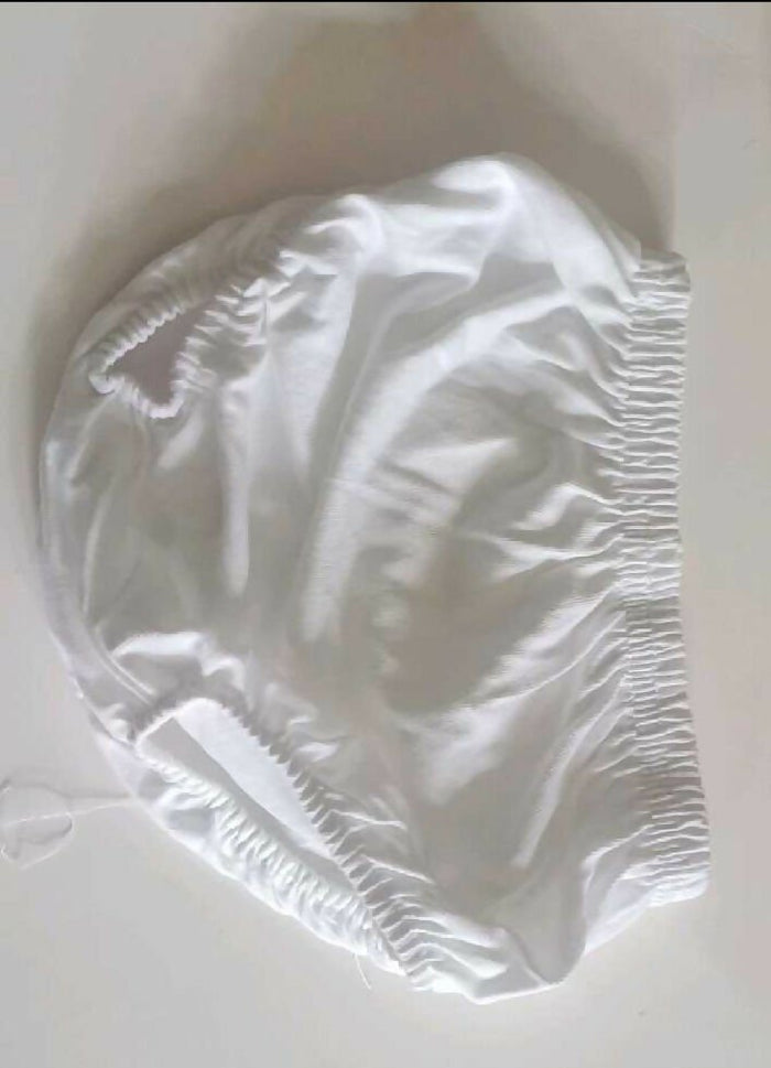 White shower cap on a white background