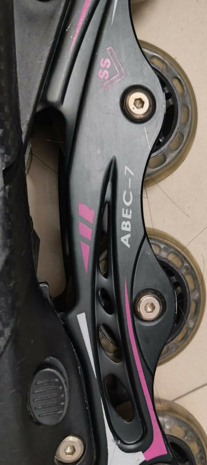 Close-up of a rollerblade with ABEC-7 bearings on a dark background
