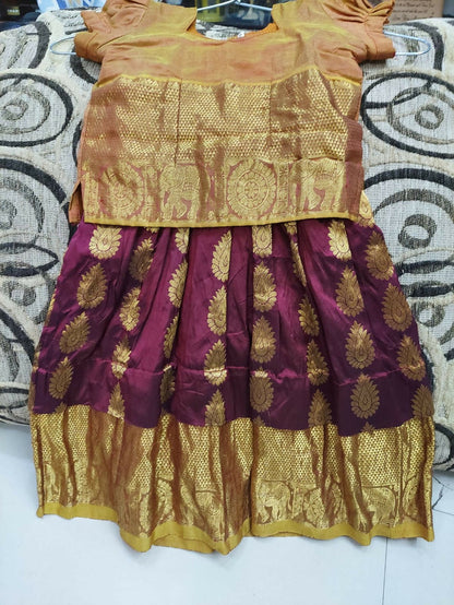 Traditional outfit with gold and maroon fabric