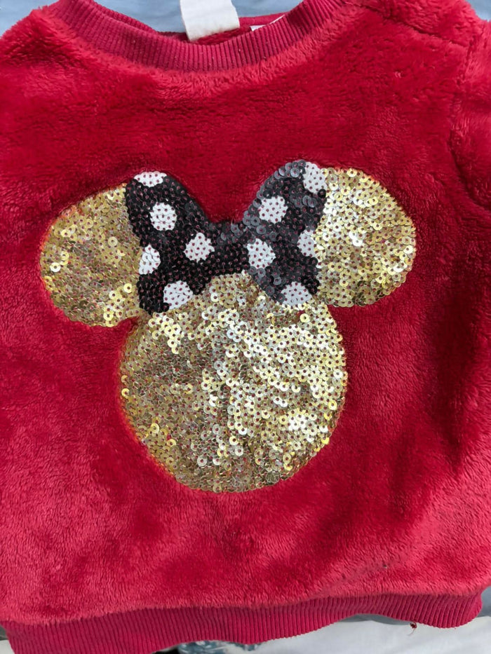 Wrap your little one in warmth and magic with this soft faux fur sweater from H&amp;M’s Disney collection.