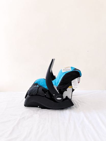Evenflo Embrace infant car seat with base, rear-facing design, cushioned newborn support, secure safety harness, and portable baby carrier functionality for safe travel.