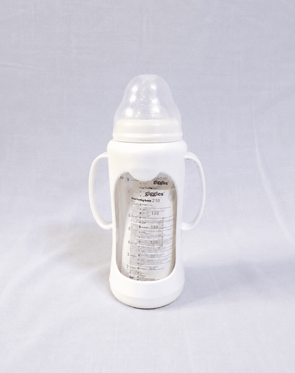 Giggles 210ml Glass Feeding Bottle with dual handles, BPA-free glass, soft silicone nipple, and ergonomic design for comfortable, safe, and easy feeding for babies learning to hold a bottle.