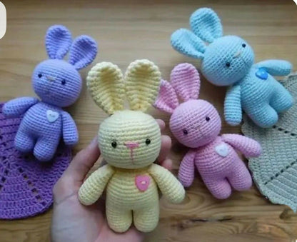 Handcrafted crochet bunny made from soft yarn with intricate stitching, adorable floppy ears, and a cuddly design, perfect for babies, kids, gifting, and nursery décor.