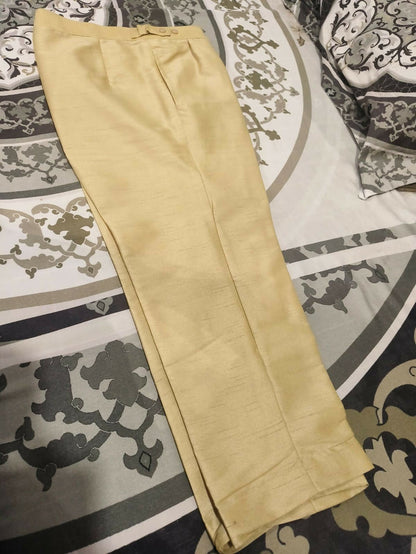 Beige pants on a patterned rug