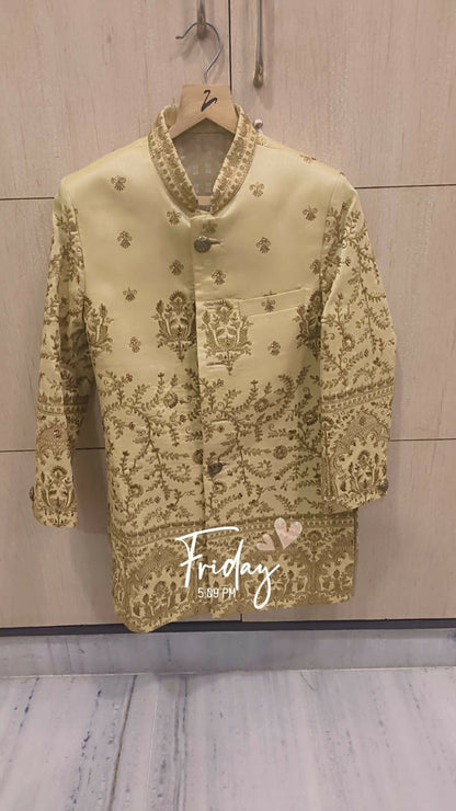 Light green embroidered blouse on a hanger with 'Friday' text on a wooden background