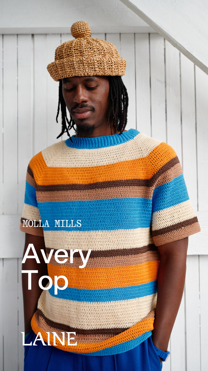 Person wearing a colorful striped Avery Top sweater designed by 'Molla Mills'
