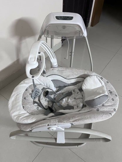 INGENUITY gliding swing and rocker with gentle gliding motion, cushioned seat, safety harness, and soothing design for relaxing, comforting, and entertaining babies.