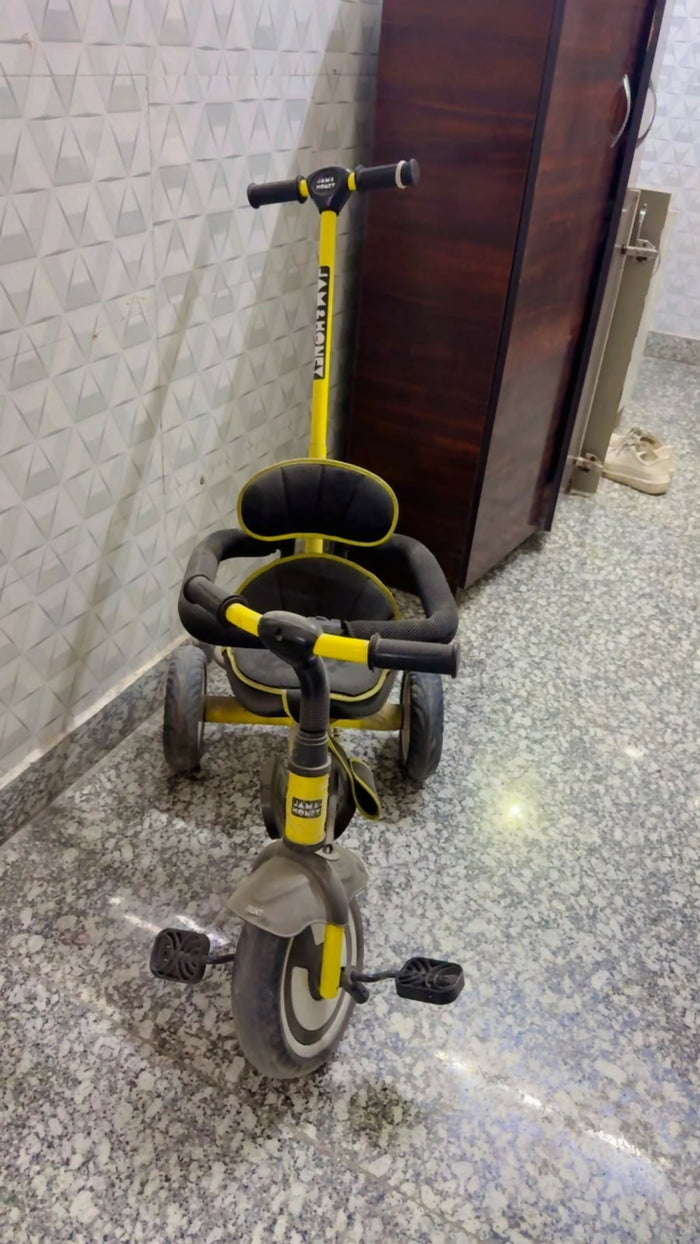 Jam & Honey Baby Tricycle in Almost New condition featuring a sturdy frame, comfortable seat, easy-grip handlebars, smooth wheels, and child-friendly design for fun riding and active outdoor play.