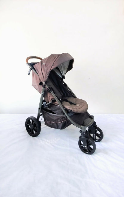 Joie Premium Baby Stroller B010 in Some Used condition, available in Chennai, Tamil Nadu, featuring a lightweight foldable frame, comfortable seat, 5-point safety harness, protective canopy, and smooth wheels for everyday travel.