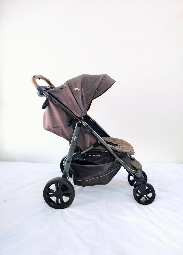 Joie Premium Baby Stroller B010 in Some Used condition, available in Chennai, Tamil Nadu, featuring a lightweight foldable frame, comfortable seat, 5-point safety harness, protective canopy, and smooth wheels for everyday travel.