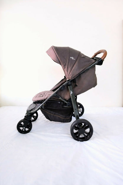 Joie Premium Baby Stroller B010 in Some Used condition, available in Chennai, Tamil Nadu, featuring a lightweight foldable frame, comfortable seat, 5-point safety harness, protective canopy, and smooth wheels for everyday travel.