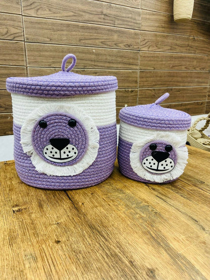 Two purple and white bear-themed storage baskets