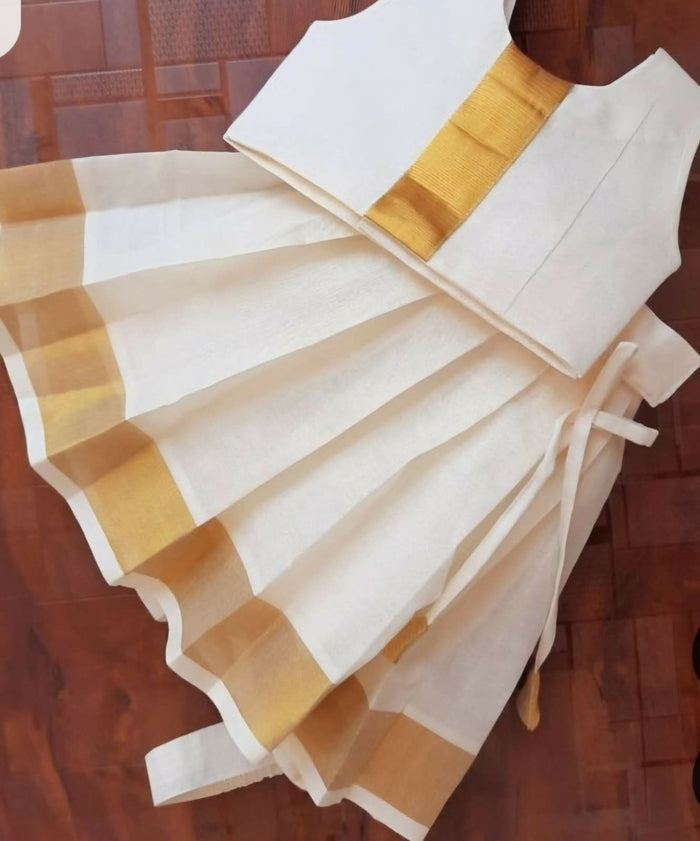 Introduce your child to the elegance of traditional Kerala fashion with this Kerala Style Frock/Dress for kids.