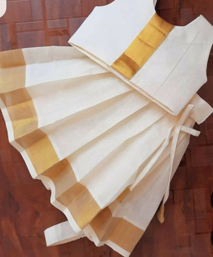 Introduce your child to the elegance of traditional Kerala fashion with this Kerala Style Frock/Dress for kids.
