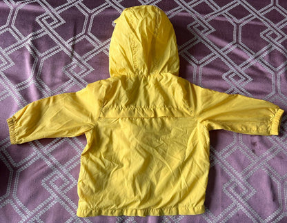 Lion-themed windcheater for kids made from lightweight, wind-resistant fabric with a hood, front zipper, and playful lion design for comfortable outdoor wear.