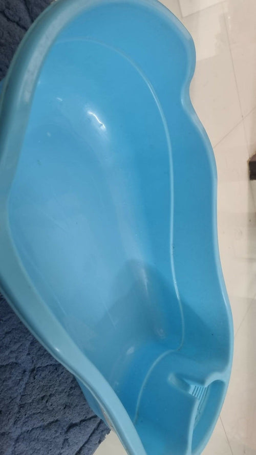 LITTLE KIDS Baby Bathtub in Almost New condition featuring an anti-slip base, spacious bathing area, smooth edges, and child-friendly design for comfortable and convenient supervised baby bath time.