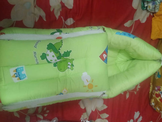 LUVLAP 3-in-1 Soft Cotton Baby Carry Nest in Dino Print, Almost New condition, featuring soft cotton fabric, cushioned bedding, and a cozy portable design for carrying, resting, and supervised lounging.