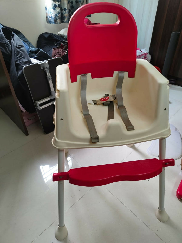 LUVLAP 4-in-1 Convertible Baby High Chair in Almost New condition with feeding tray, footrest, low chair and booster seat modes, comfortable seating, and safety support for convenient baby and toddler mealtimes.