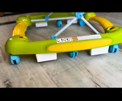 Colorful baby walker on a wooden floor