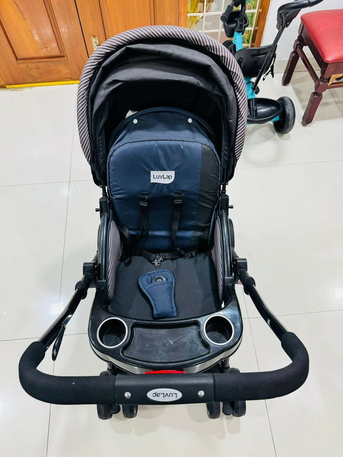 LuvLap baby stroller with lightweight foldable design, reclining seat, adjustable canopy, 5-point safety harness, smooth wheels, and storage basket for comfortable travel with babies and toddlers.