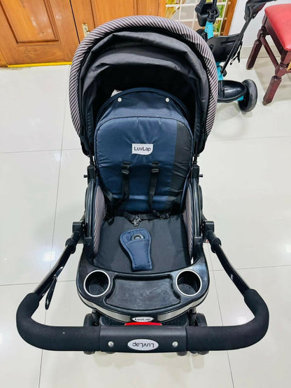 LuvLap baby stroller with lightweight foldable design, reclining seat, adjustable canopy, 5-point safety harness, smooth wheels, and storage basket for comfortable travel with babies and toddlers.