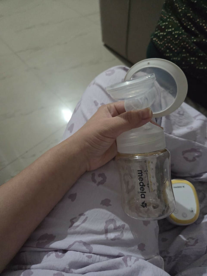 Medela electric breast pump, Medela breast pump for nursing mothers, portable electric breast pump, Medela milk pump, efficient breast pump for travel, quiet breast pump for moms