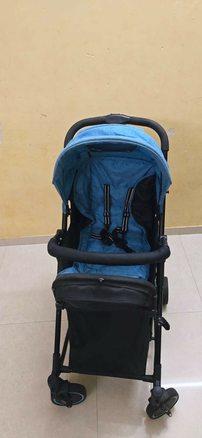 MEE MEE 2-in-1 stroller/pram with rocking function, foldable design, reclining seat, adjustable canopy, 5-point safety harness, smooth wheels, and storage basket for comfortable travel and soothing babies.